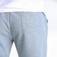 Мъжете и жените могат да носят солидни цветови панталони за джогинг